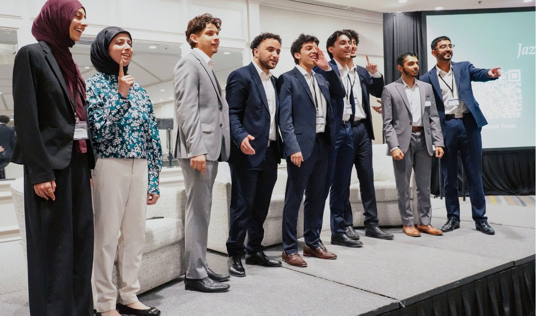 Conference participants together on stage